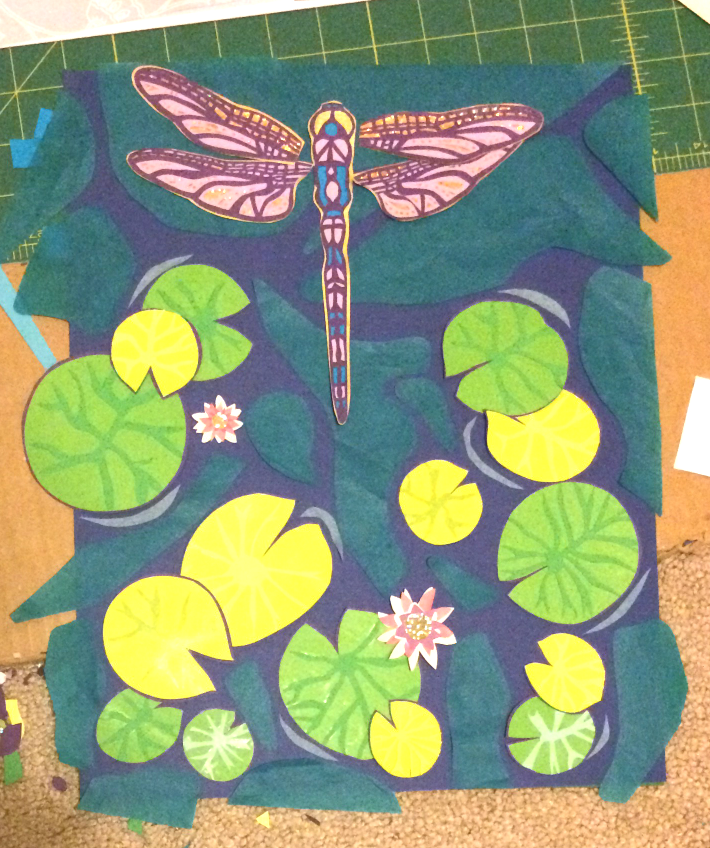 Many more hours of work and it is almost done.  I decided to do a combination of lilac and sparkly gold under the wings, blue paper in parts of the body.  Details have been added to all the lily pads.  Note when using tissue paper (the blue/green in the water) it looks much different before it's glued.  